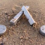 How to Rig Shrimp and Crab Pot Weights for Pacific Northwest Currents Shrimp and crab pot weights on a beach